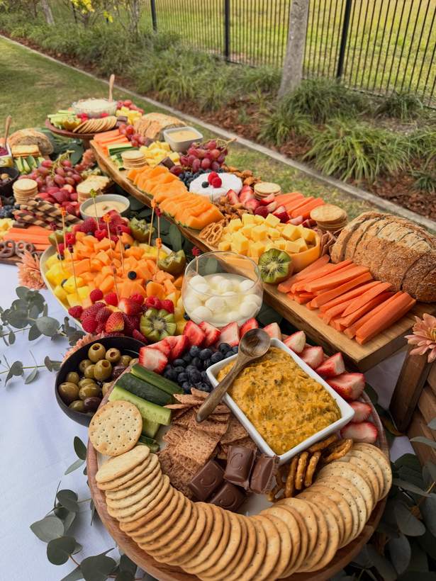 The same table from above, with fruit, crackers and dips